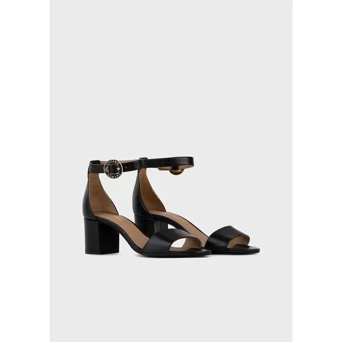 Leather sandals with heel and logoed medal
